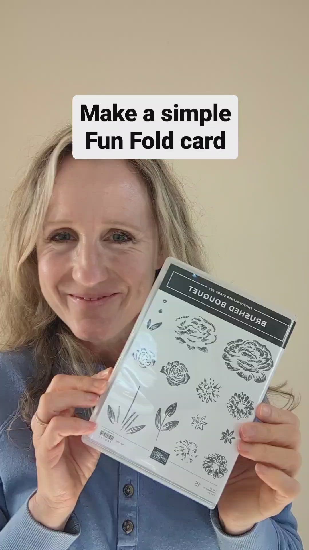 This may contain: a woman holding up a card with flowers on it and the words make a simple fun fold card