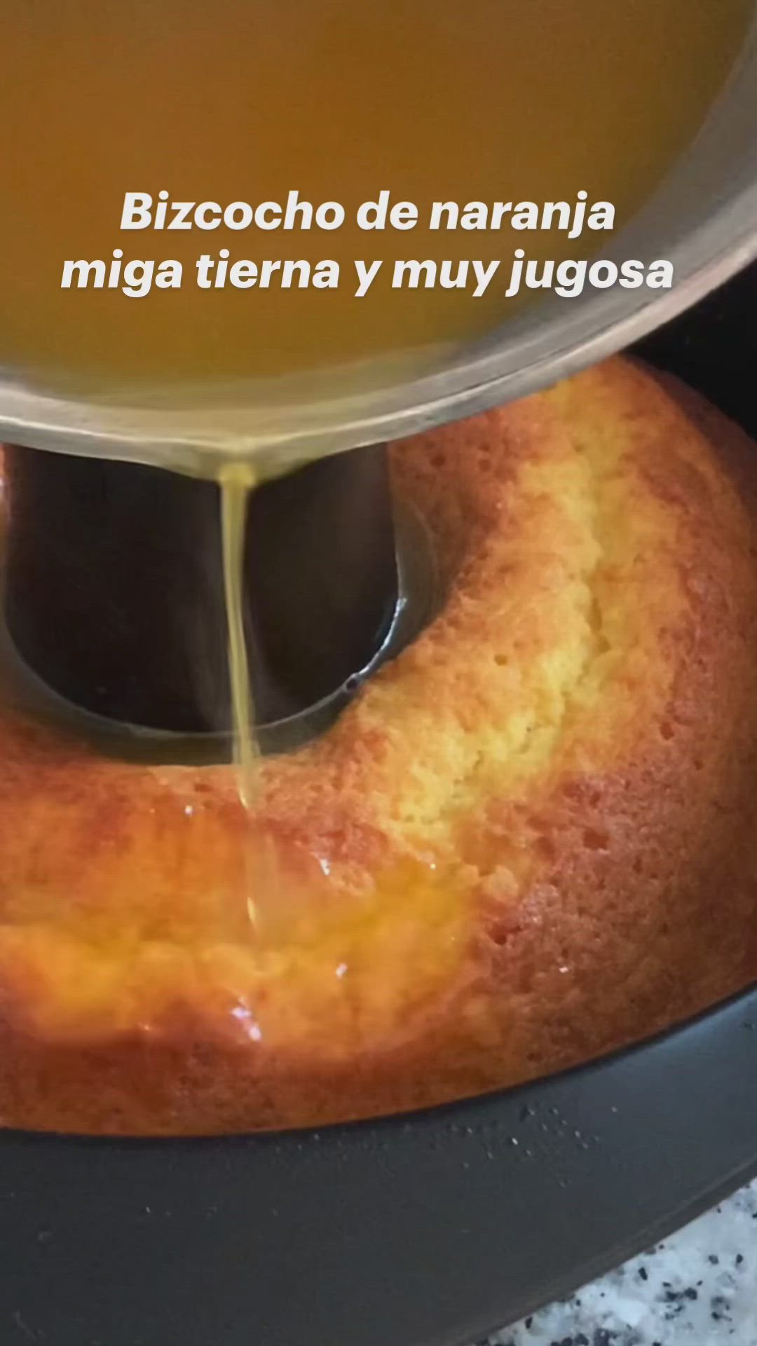 This may contain: a cake being drizzled with yellow liquid