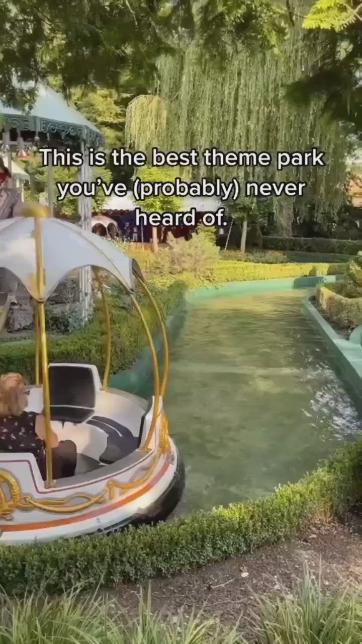 This may contain: an amusement park ride with people riding on it