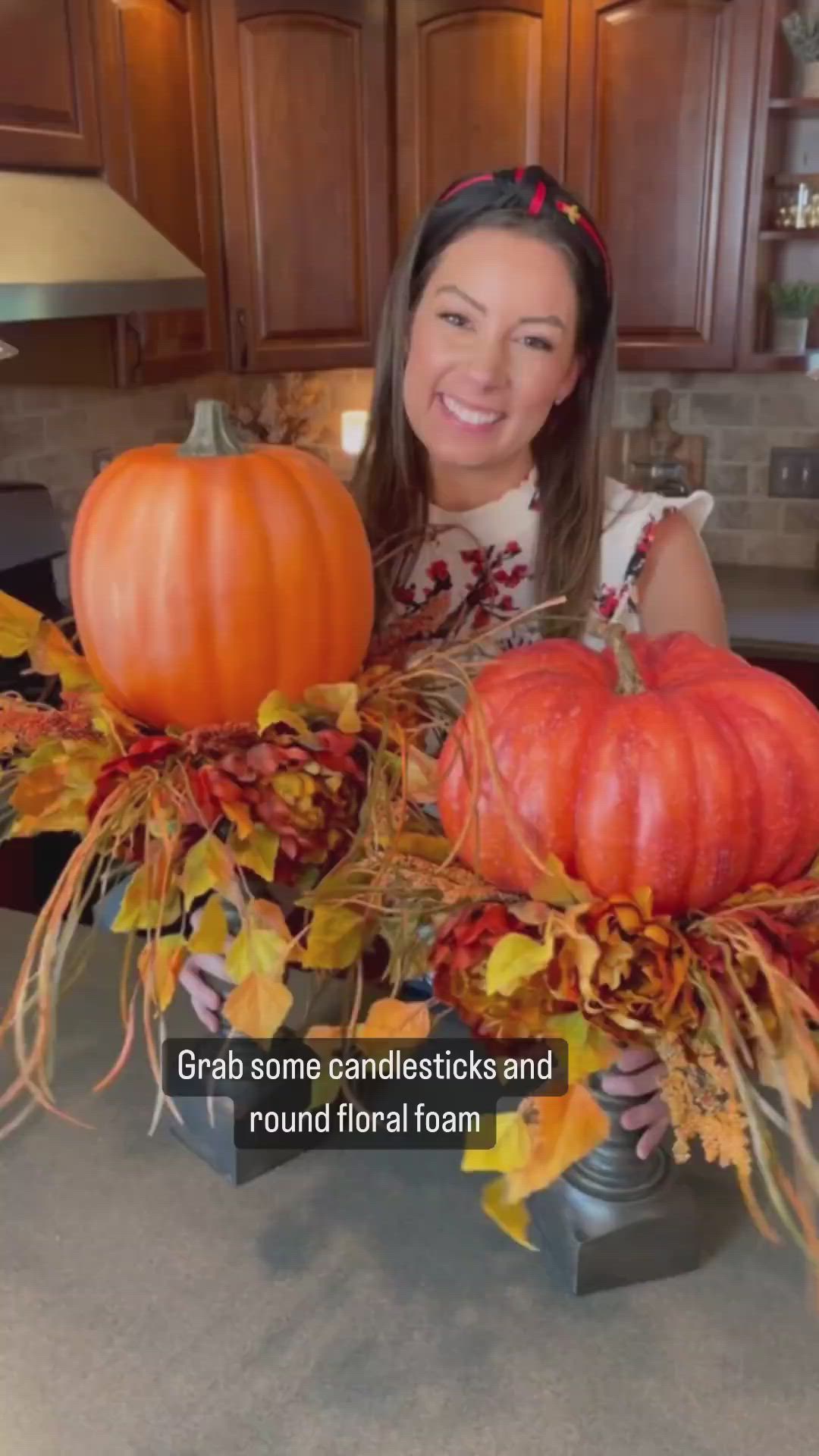 This may contain: a woman standing in front of a kitchen counter filled with pumpkins