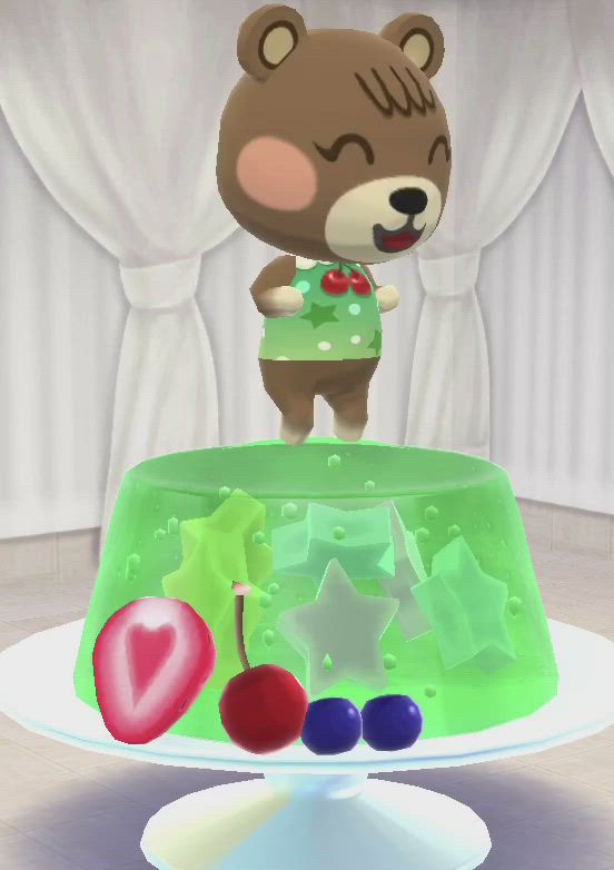 This may contain: a teddy bear standing on top of a cake with cherries and cherries in front of it