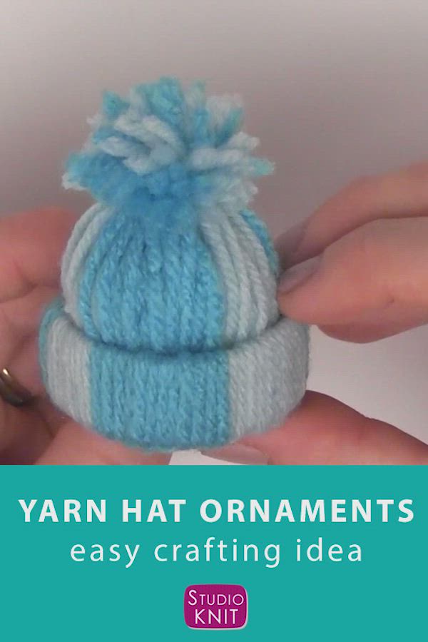 This may contain: yarn hat ornament in blue and white with text overlay that reads yarn hat ornaments easy crafting idea