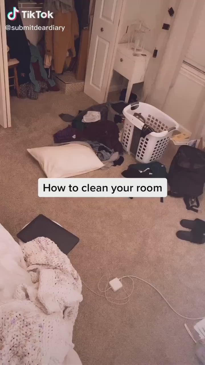 This may contain: a messy room with clothes on the floor