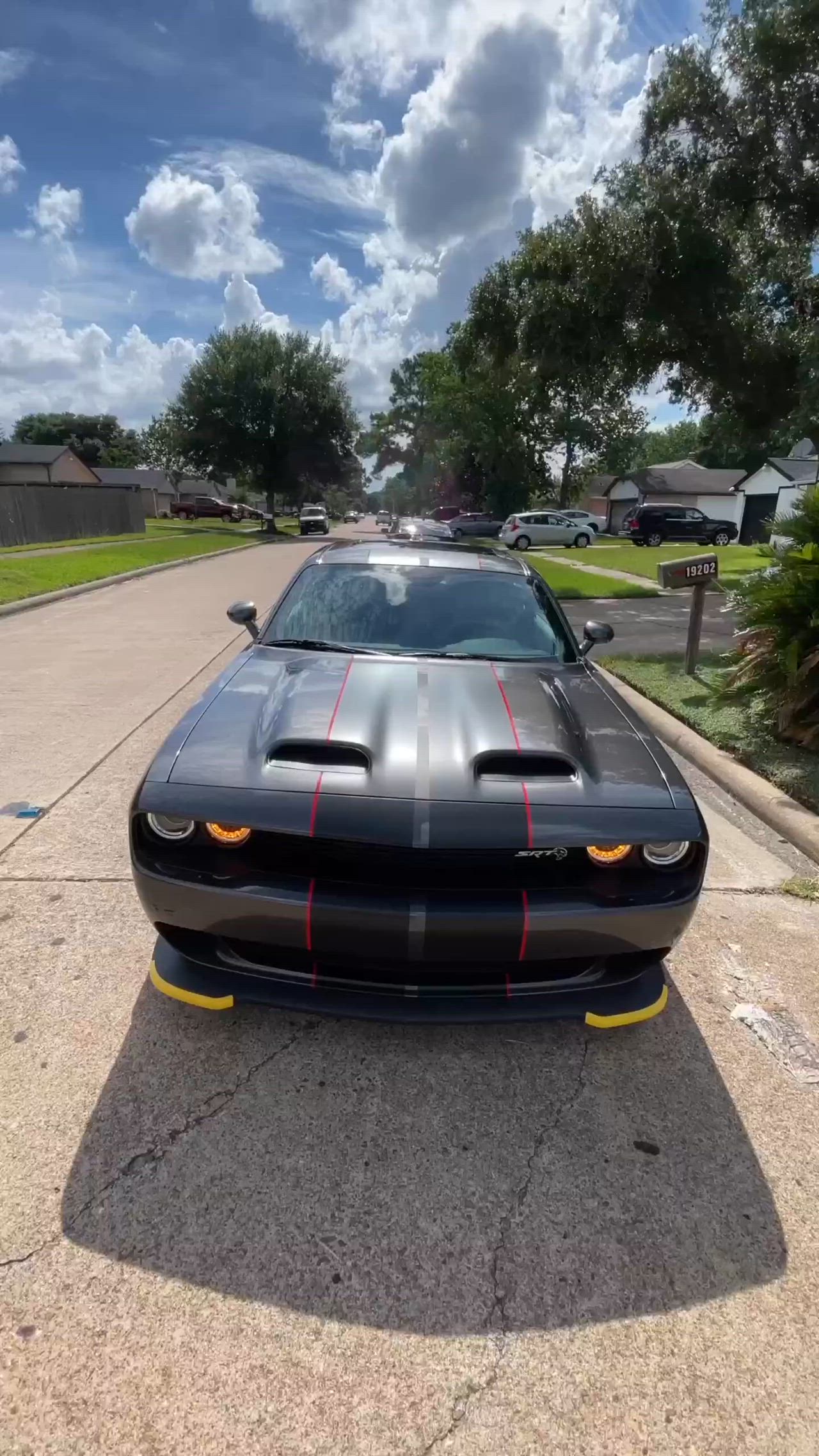 This may contain: a black sports car parked on the street