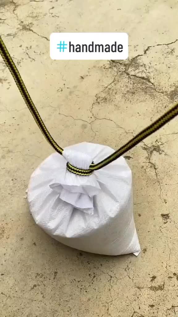 This may contain: a roll of toilet paper sitting on top of a floor next to a chain that is attached to it