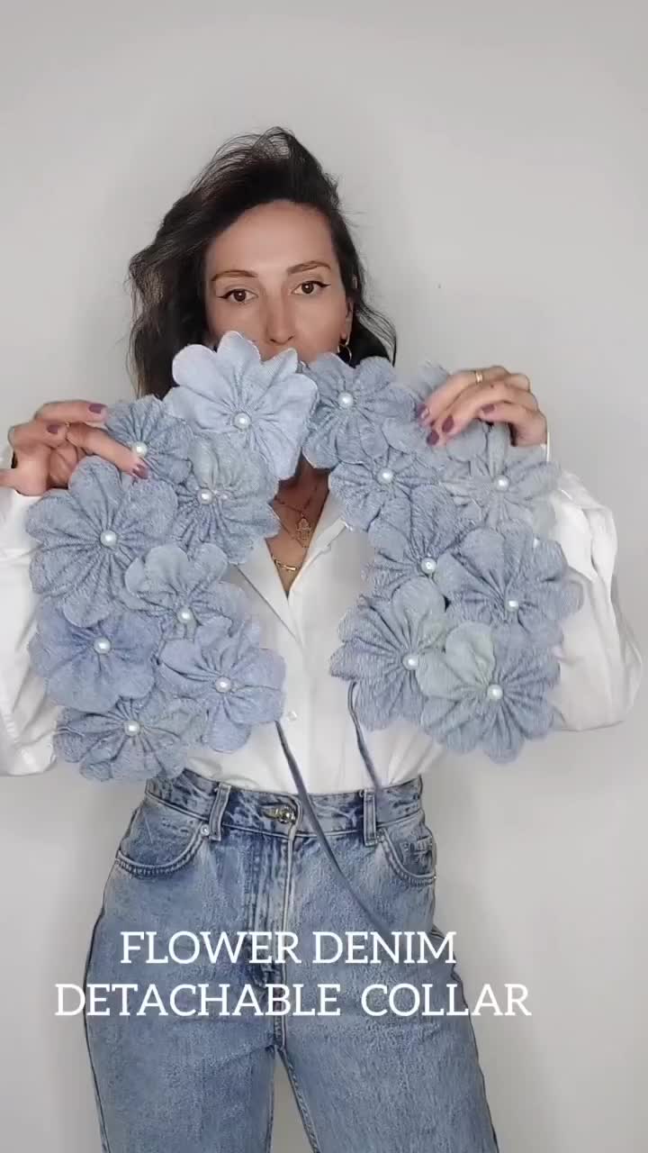 This may contain: a woman holding flowers in her hands with the words flower denim detachable collar