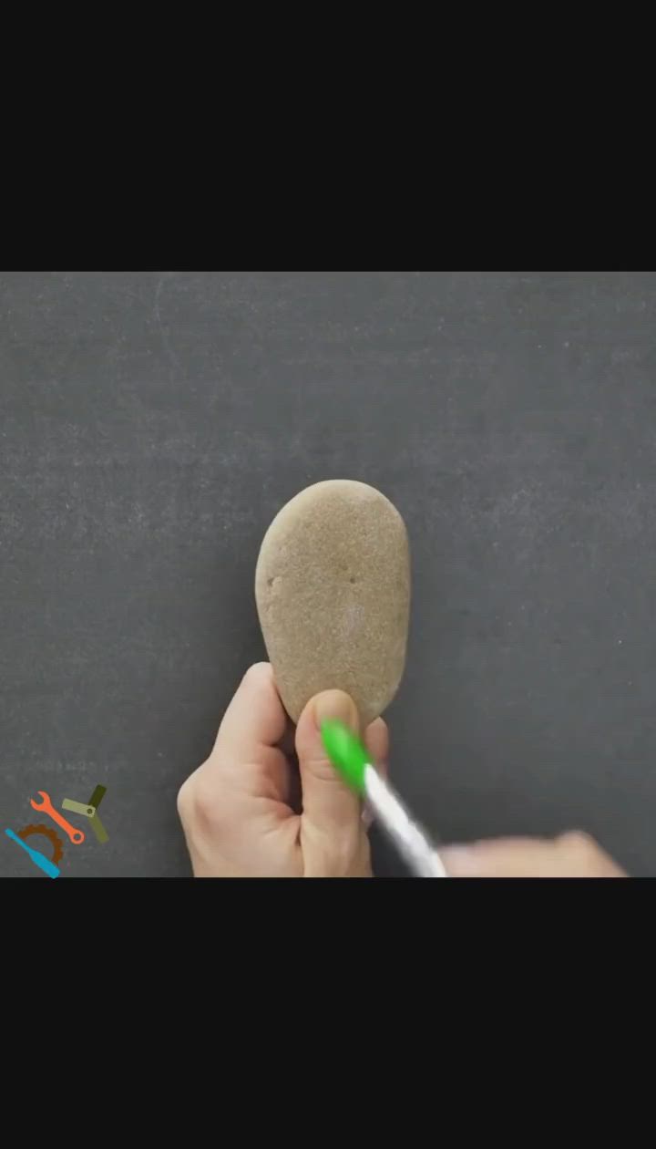 This may contain: someone is painting a heart on a chalkboard with green marker and crayons