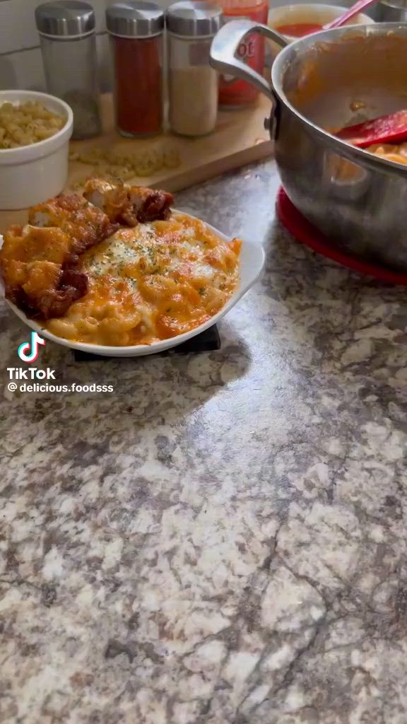 This may contain: a plate with some food on it sitting on a counter next to other bowls and pans