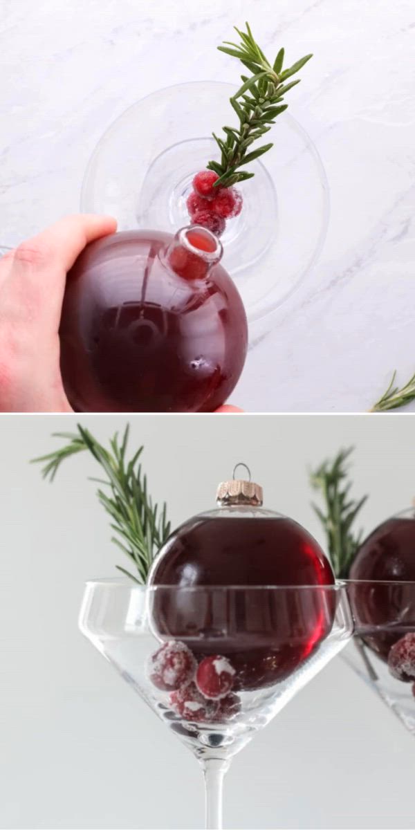 This may contain: two glasses filled with red liquid being poured into the glass for an ornament
