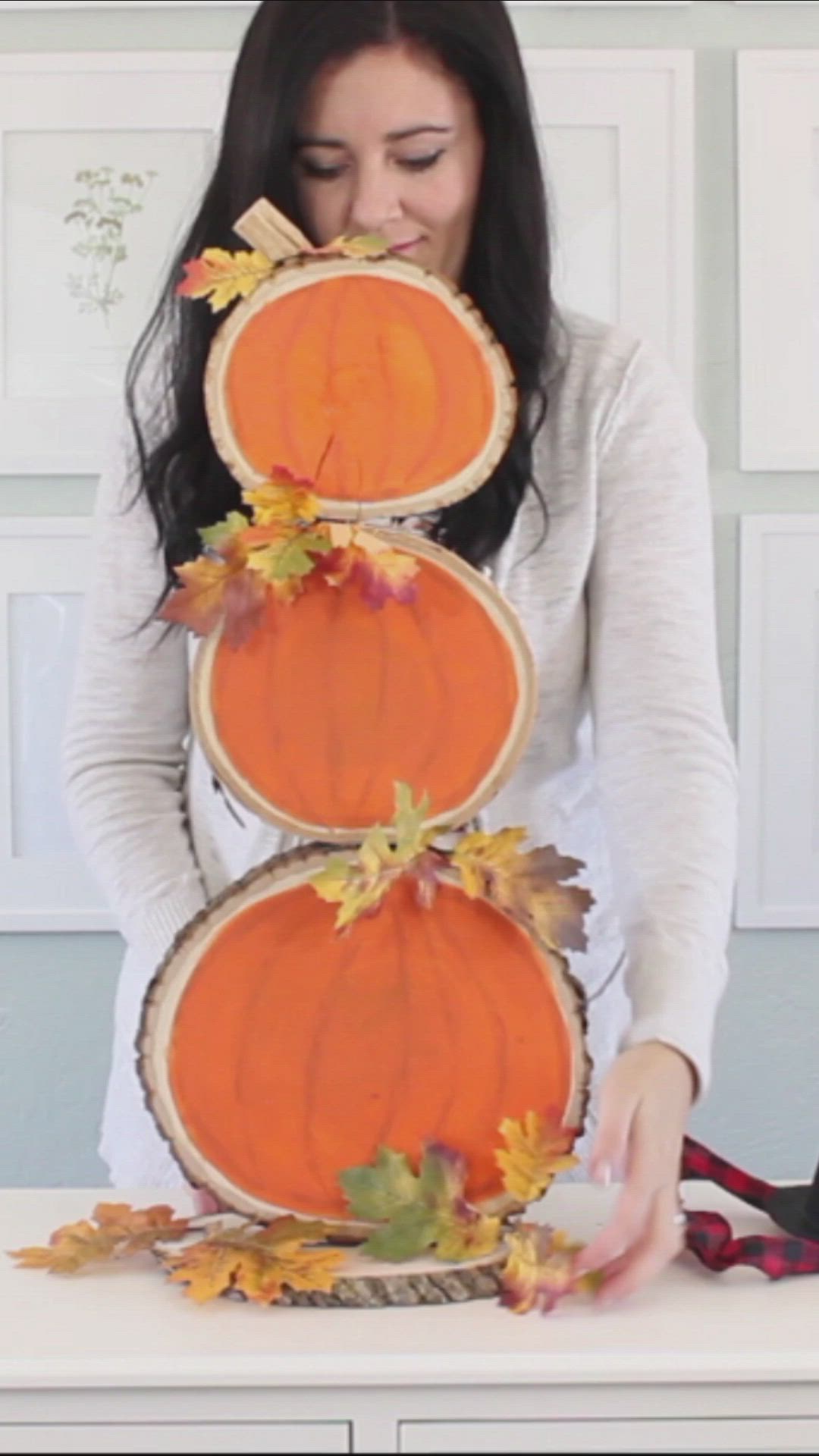 This may contain: wood slice pumpkins and snowman decorations with text overlay