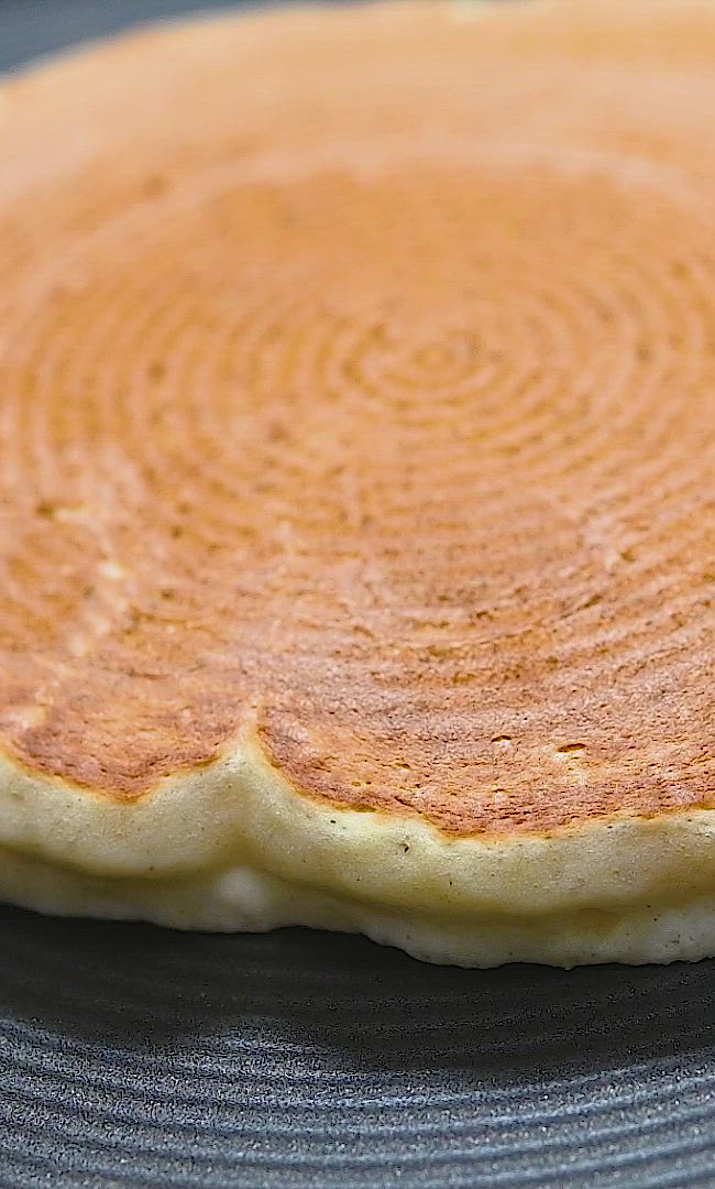 This may contain: an uncooked pancake sitting on top of a table