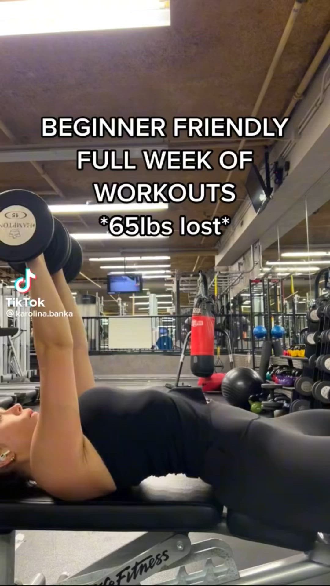 This may contain: a woman laying on top of a bench with dumbs in front of her and the words, beginner friendly full week of workout