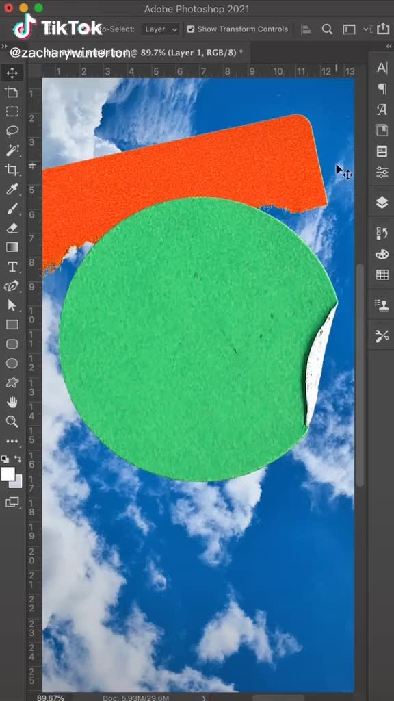 This may contain: an image of a green and orange circle in the sky with clouds behind it that has been cut out