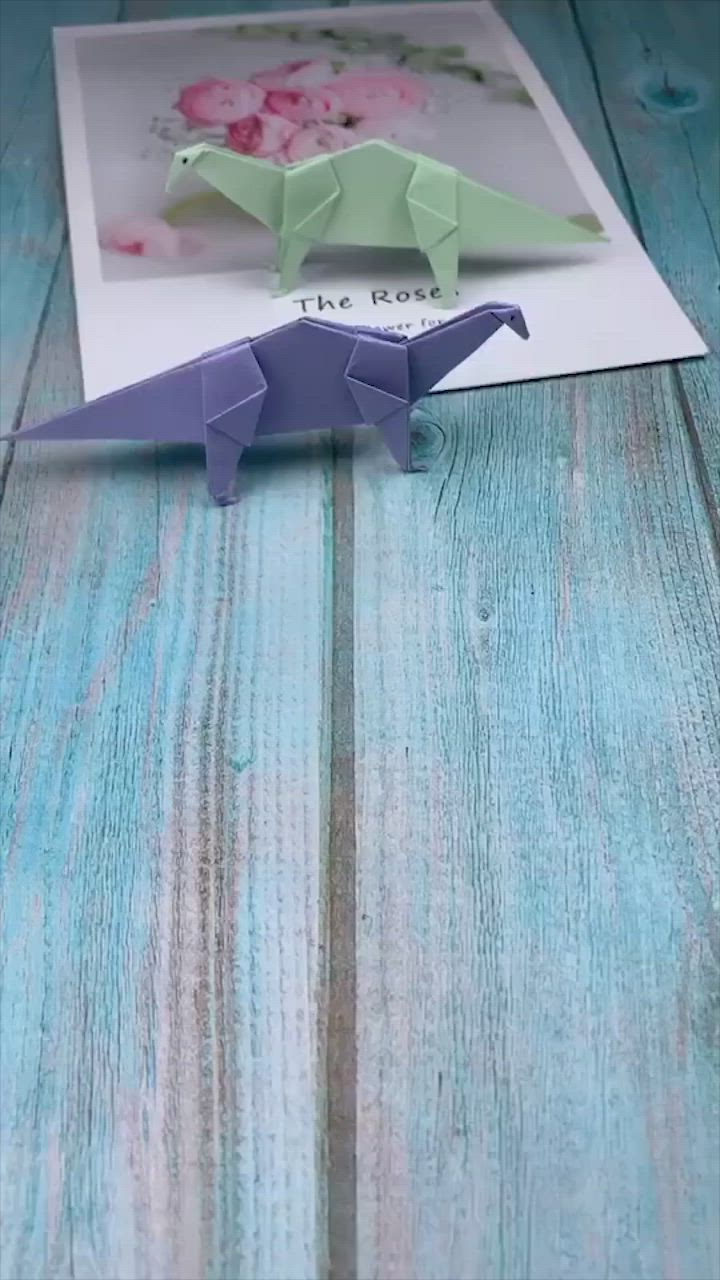 This may contain: an origami animal is being made out of paper