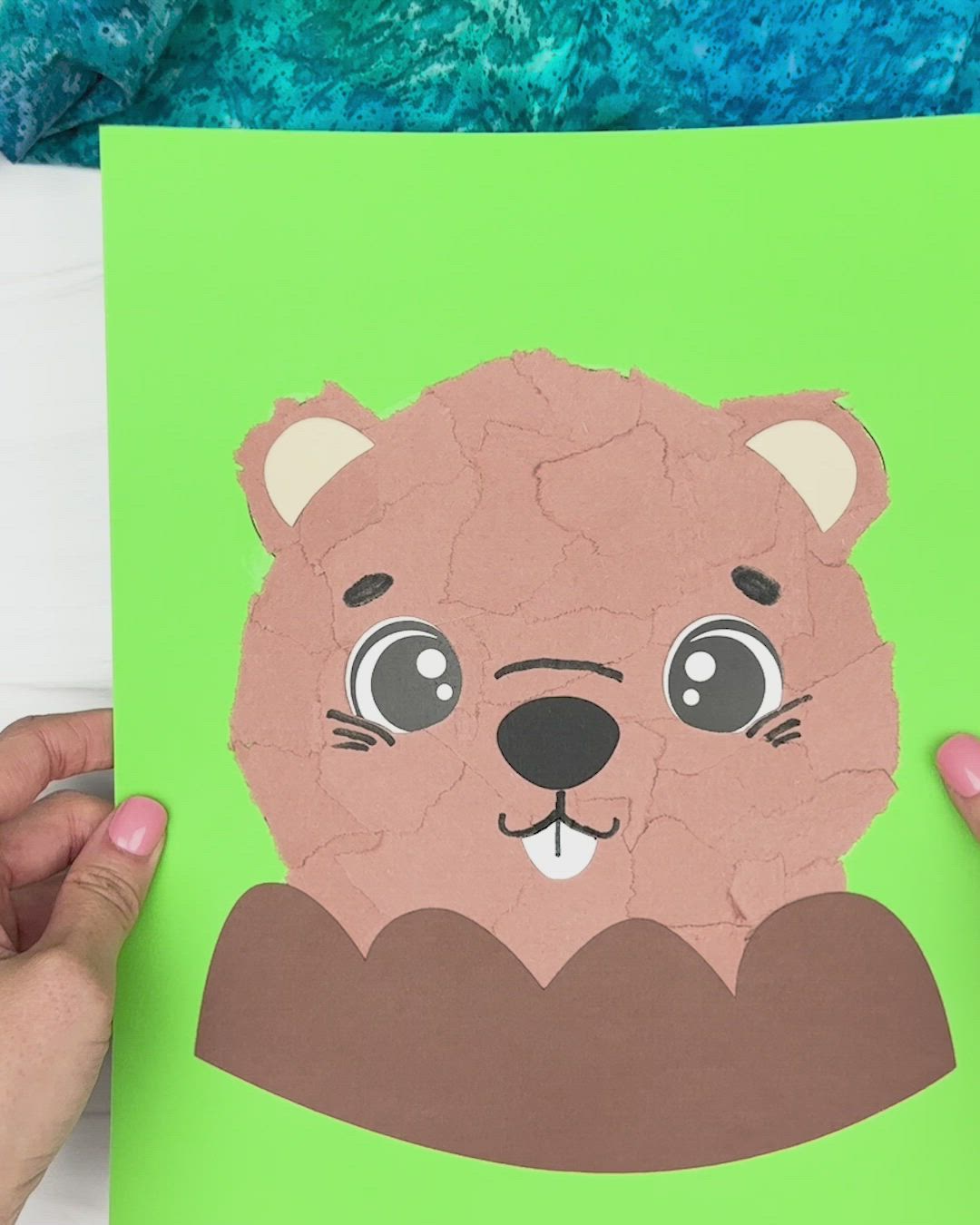 This contains: tutorial on how to make torn paper groundhog craft