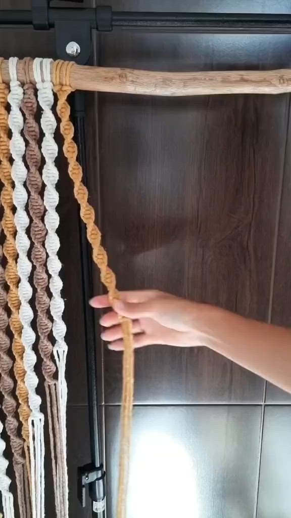This may contain: there is a wall hanging made out of rope