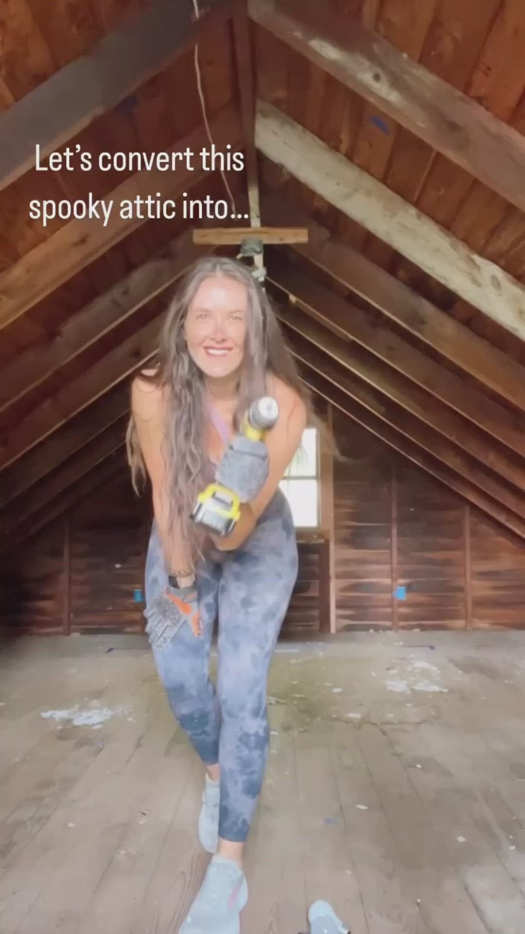 This may contain: a woman is standing in the middle of a room with white walls and ceilinging