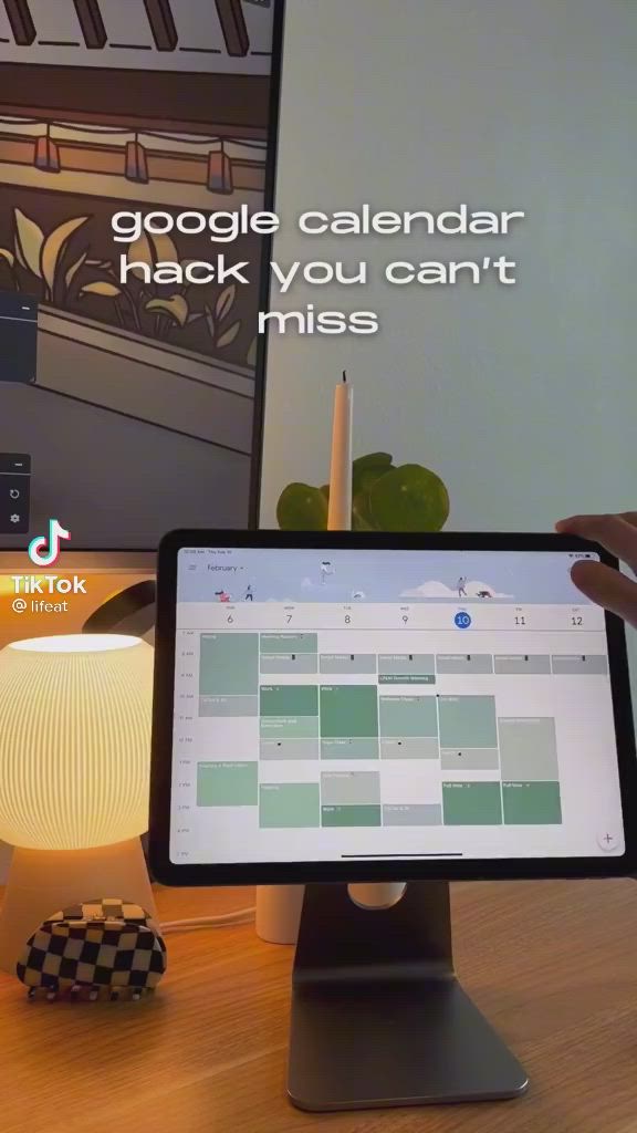 This may contain: a person is holding up a computer screen with the caption google calendar hack you can't miss