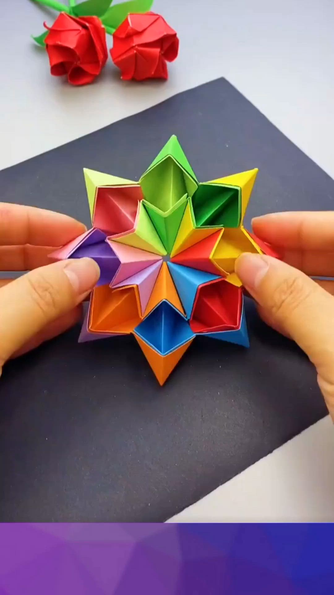 This may contain: someone is holding origami in their hands