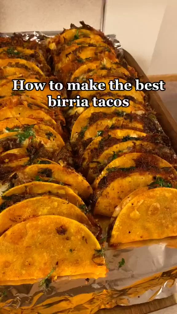 This may contain: some tacos sitting on top of a pan with the words how to make the best burrito tacos