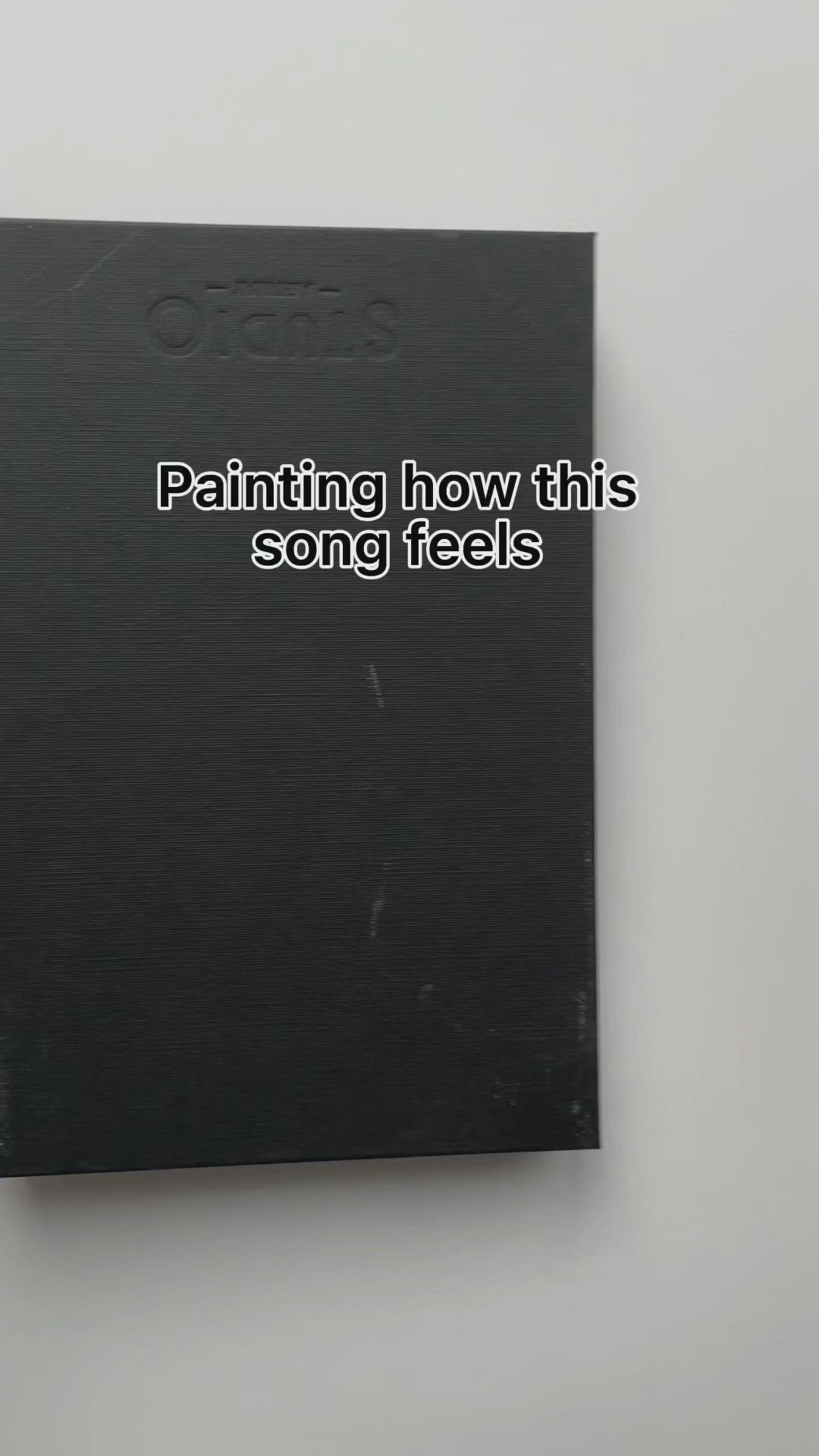 This may contain: a black book with the title painting how this song feels on it's cover