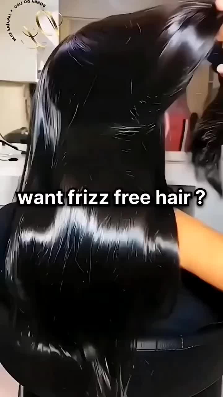 This may contain: a woman is blow drying her hair with an electric blow dryer and the caption says, want friz free hair?