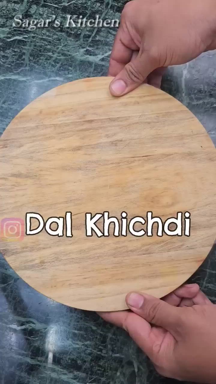 This may contain: a person is spooning food in a bowl with the words dal khichad on it