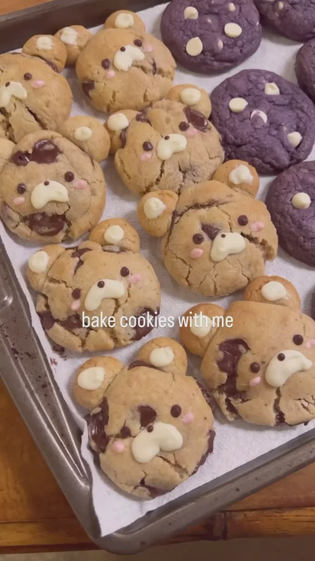 This may contain: chocolate chip cookies with marshmallows in the shape of teddy bear's face