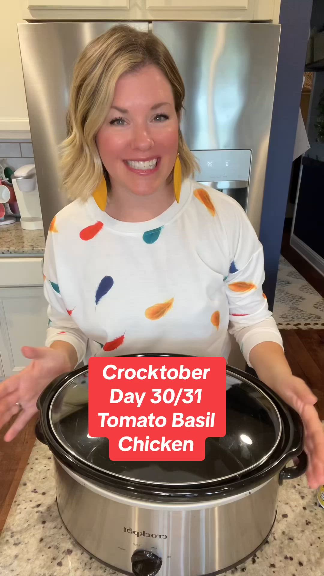 This may contain: a woman standing in front of a crock pot with the words crocktober day 30 / 31 tomato basil chicken