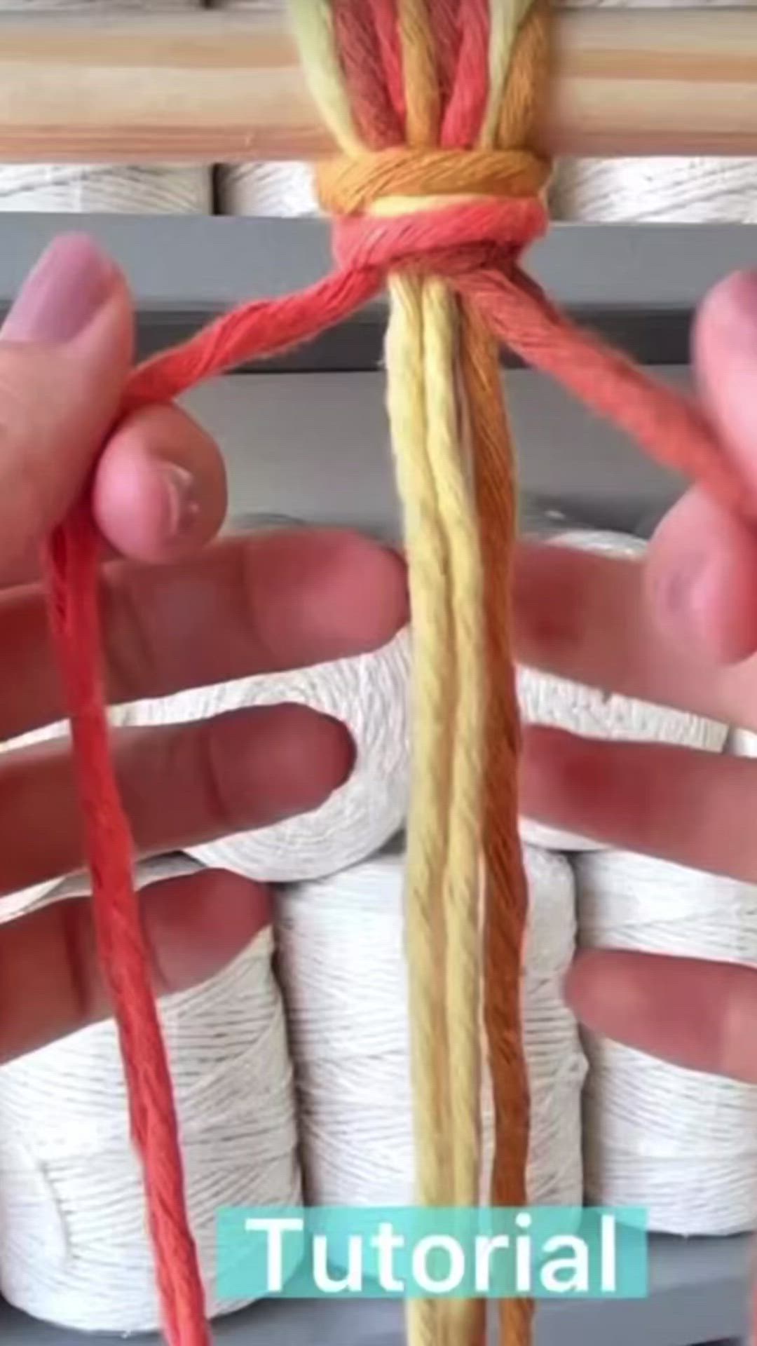 This may contain: two hands are holding twine with yarn in front of them