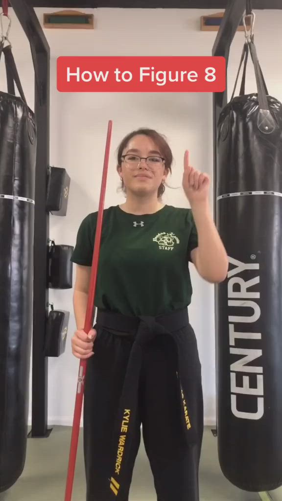 This may contain: a woman standing in front of two punching bags with the words how to figure 8