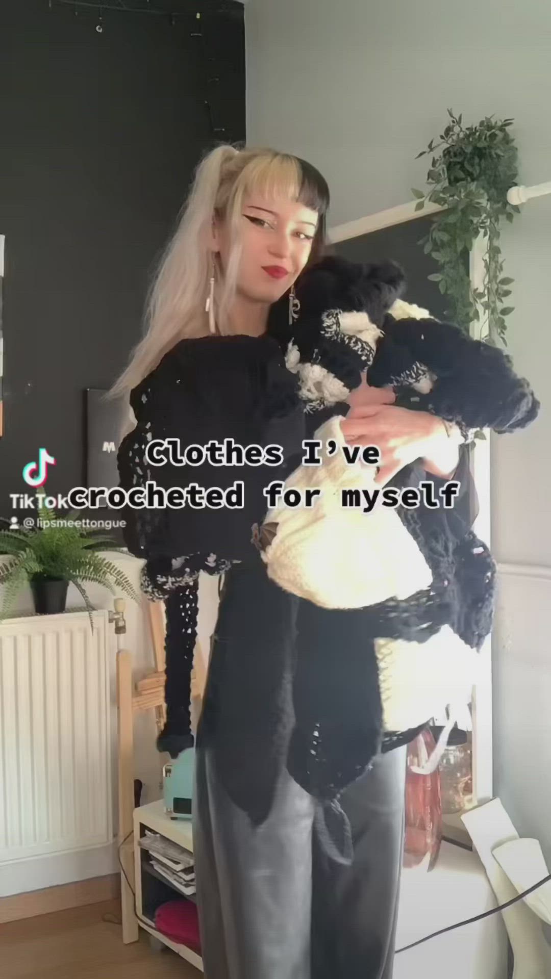 This may contain: a woman holding a stuffed animal in her arms with the caption, clothes iv've been corrected for mystirt