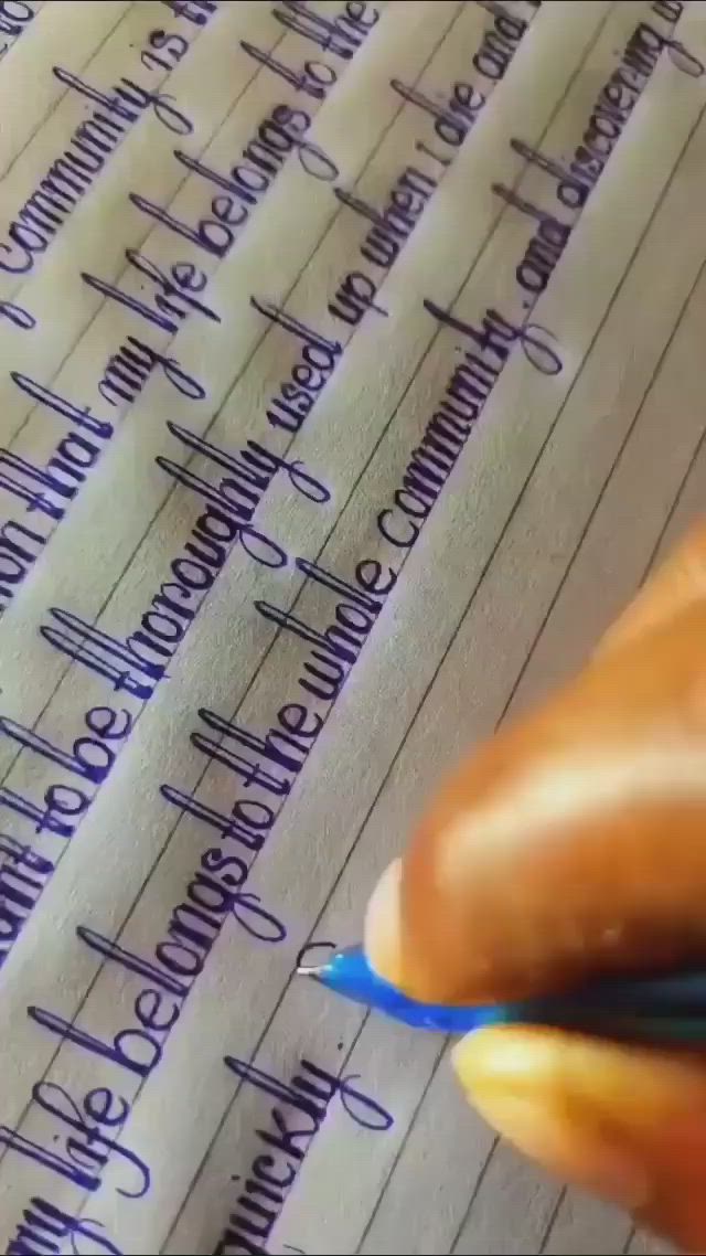 This may contain: a person writing with a pen on top of a piece of paper that is lined in blue ink