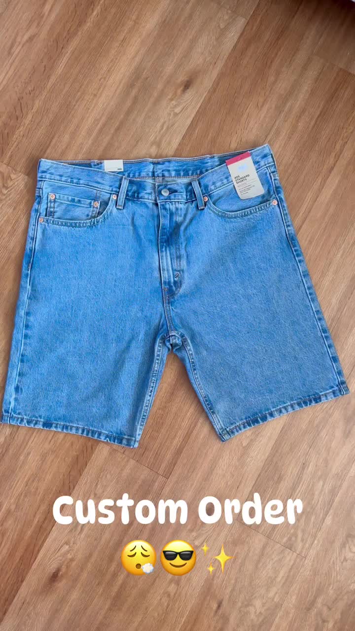 This may contain: a pair of blue shorts with smiley faces drawn on them and the words custom order