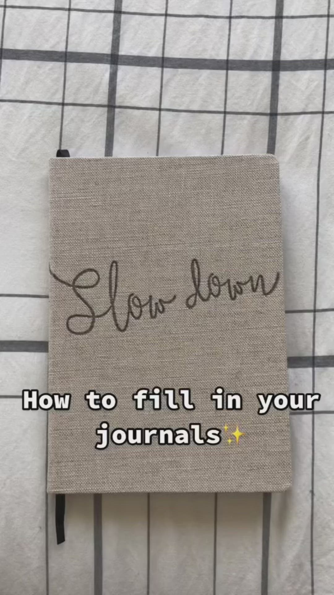 This may contain: a book with the title slow down how to fill in your journals written on it