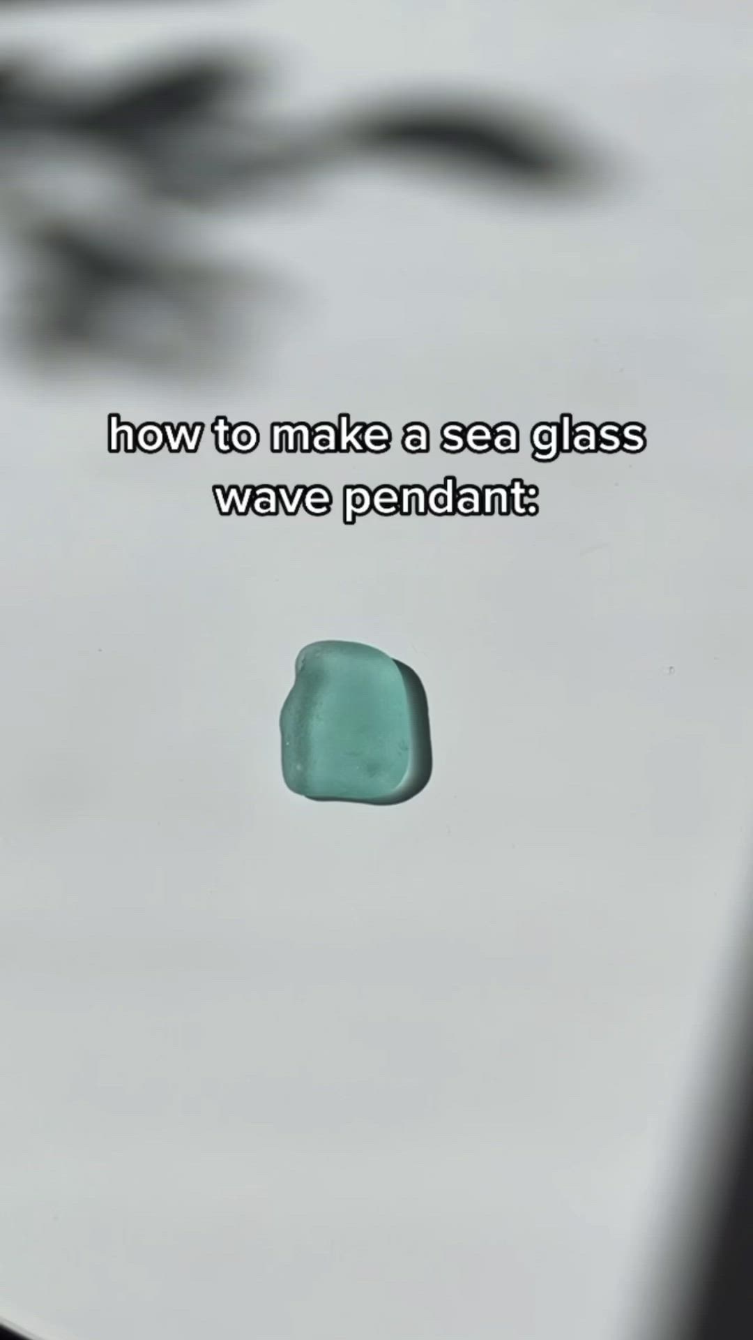 This may contain: a blue piece of glass sitting on top of a table