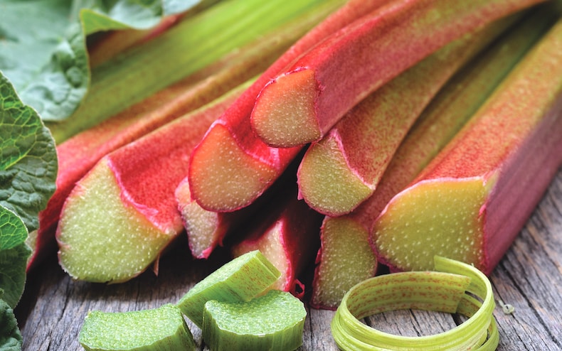 Closeup of rhubarb stalks on wooden table