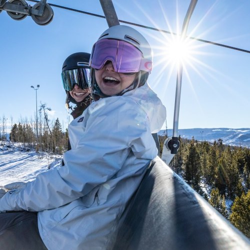 Girls on a chairlift at Granby Ranch
