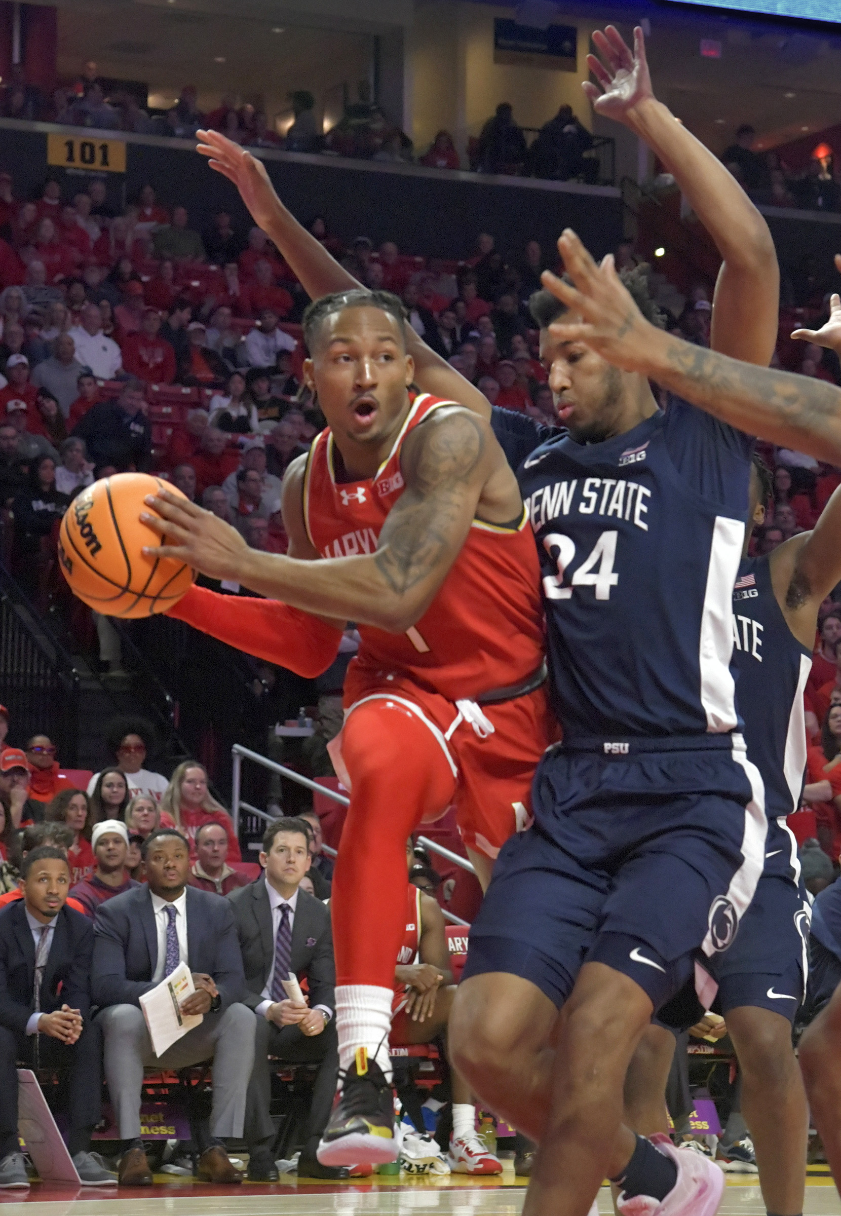 Dec. 6, 2023: Maryland Jahmir Young #1 looks for an opening to pass with Penn State Zach Hicks #24 closing in on him. Maryland beat Penn State, 81-75, in overtime. (Amy Davis/Staff photo)