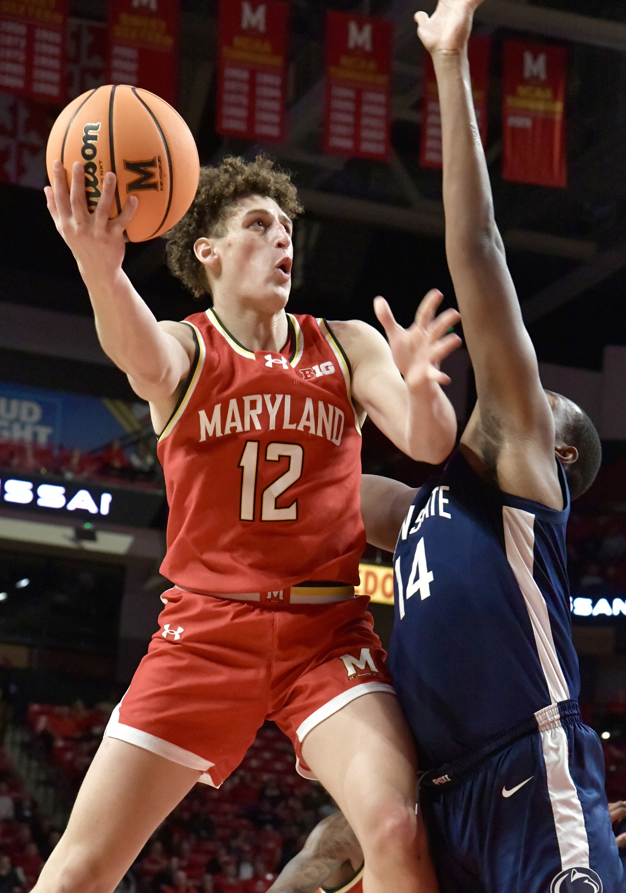 Dec. 6, 2023: Maryland's Jamie Kaiser Jr. #12 shoots over Penn State's Demetrius Lilly #14. (Amy Davis/Staff photo)