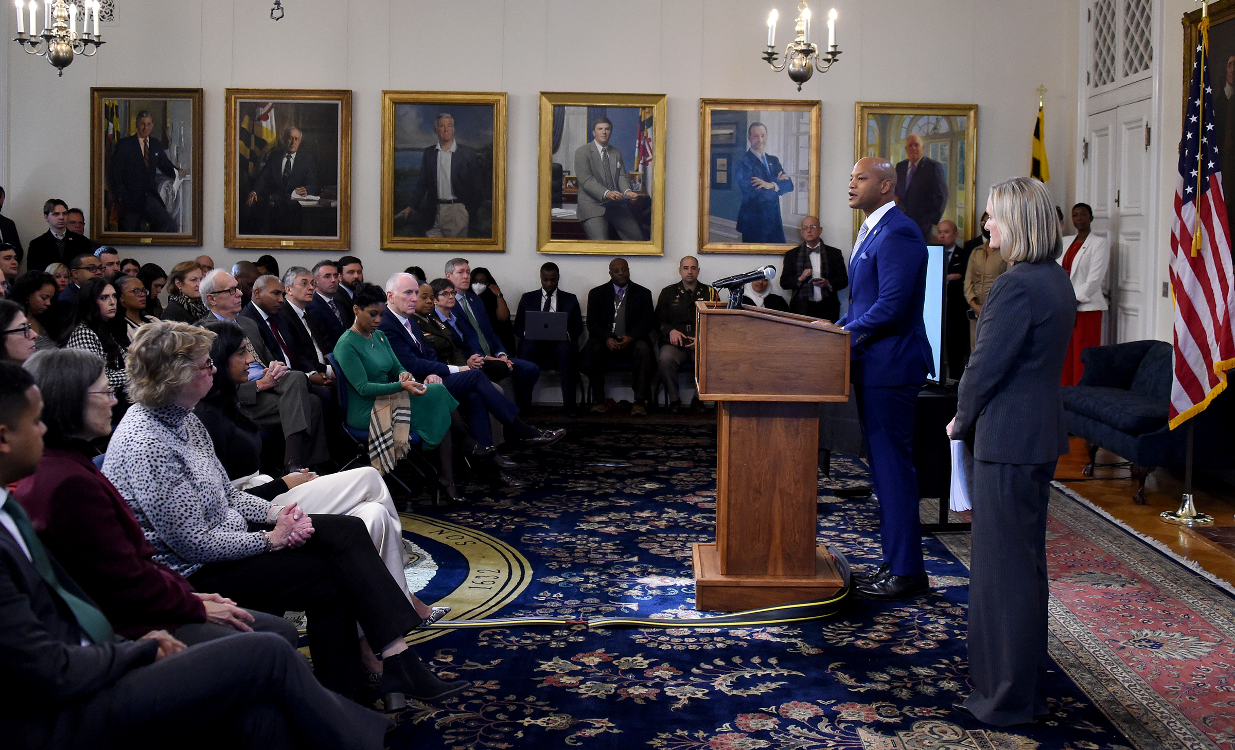 Gov. Wes Moore, at podium, along with Secretary of Budget and Management Helene Grady, right, present the administrationxe2x80x99s budget for fiscal year 2025 in a news conference this morning at the Maryland State House. (Barbara Haddock Taylor/staff photo)