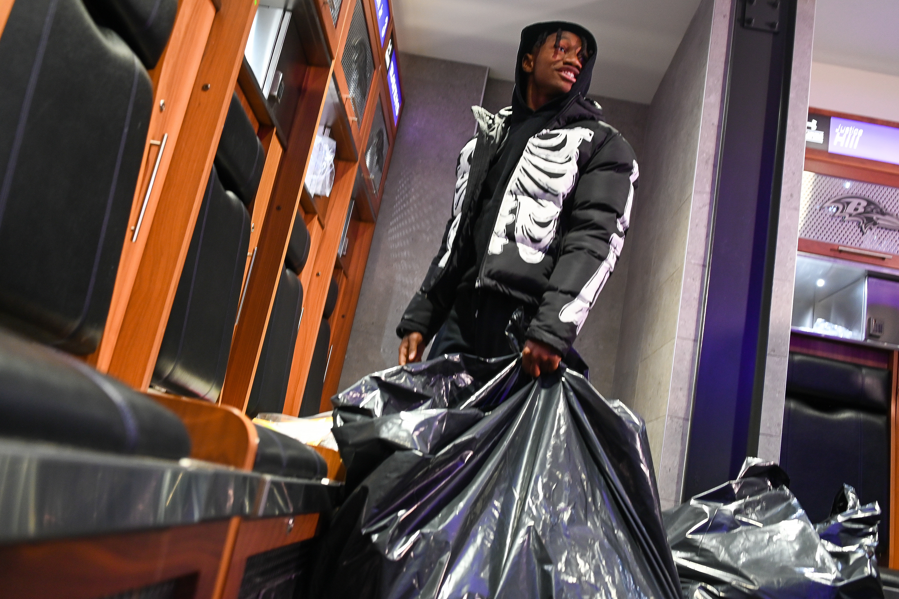 Ravens' Zay Flowers cleans out his locker as players packed up their belongings a day after their season-ending loss to the Kansas City Chiefs in the AFC championship. (Kevin Richardson/Staff)