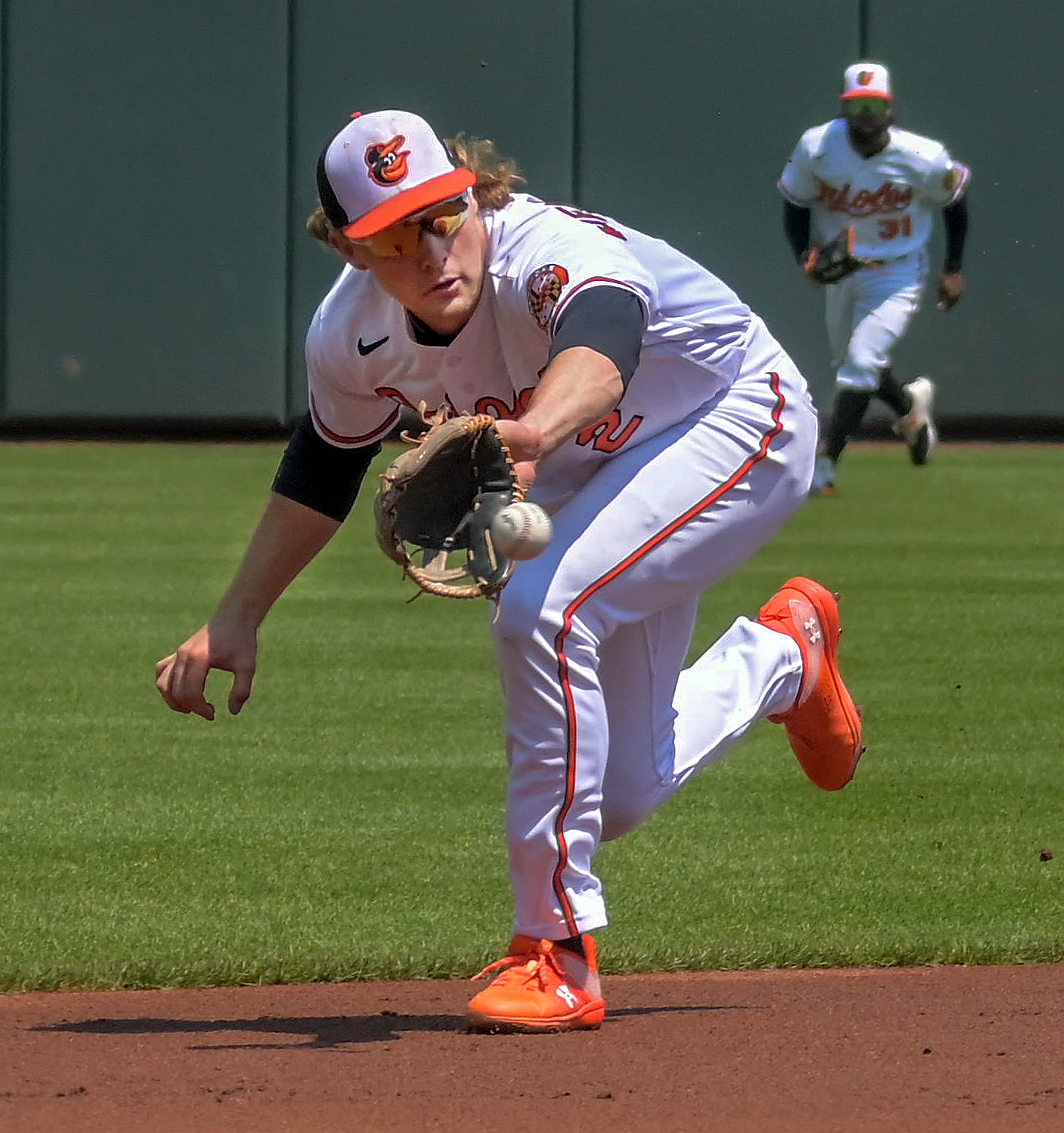 Baltimore Orioles shortstop Gunnar Henderson catches a line drive from Boston Red Sox batter Rafael Devers as center fielder Cedric Mullins watches the play during an AL East division matchup of major league baseball at Oriole Park at Camden Yards Wednesday April 26, 2023. (Karl Merton Ferron/Baltimore Sun Staff)