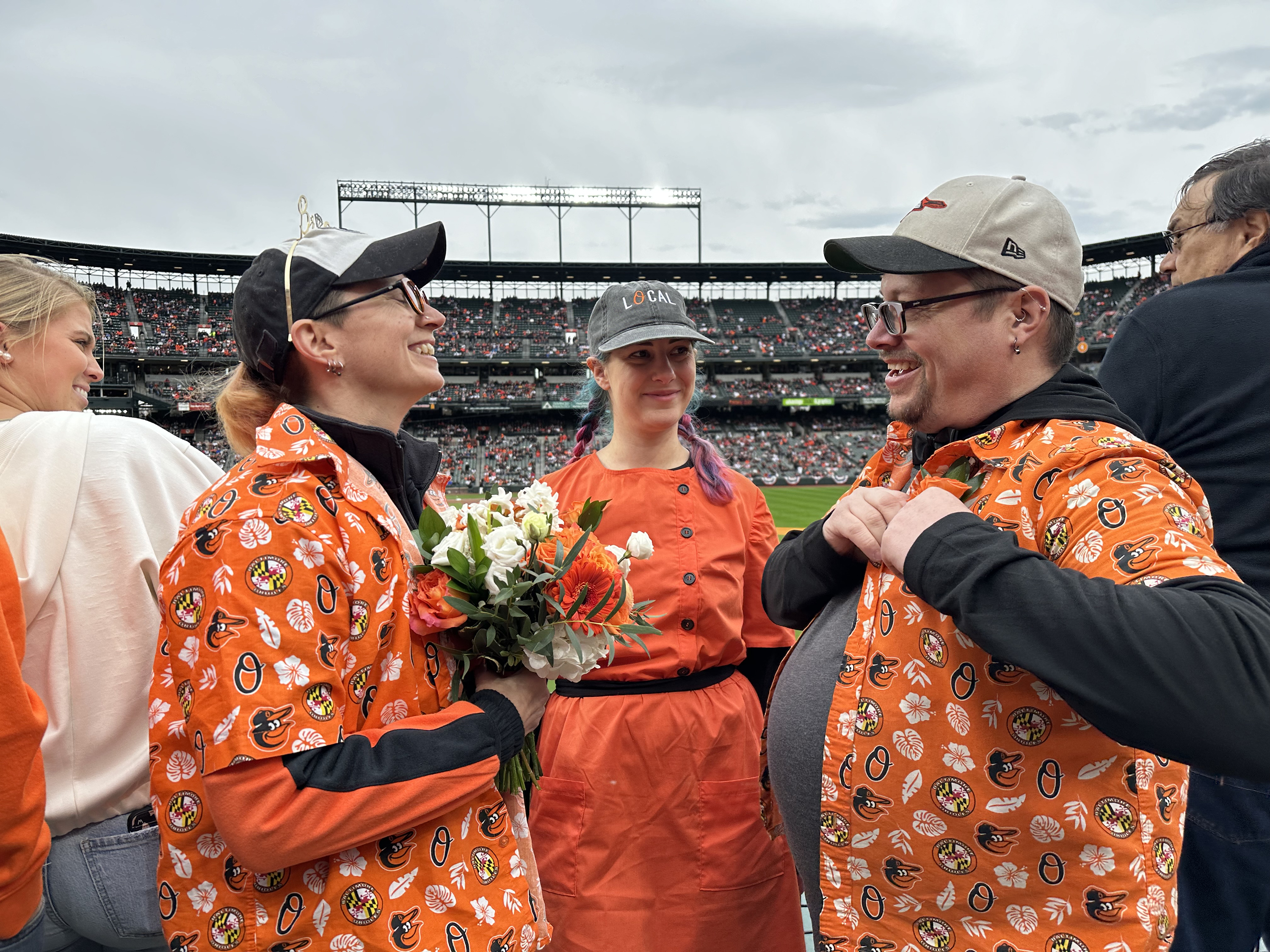 March 28, 2024: Tassie Zahner and Timm Gillette are married in right field before first pitch on opening day. The couple met in 2018 and went on their first date to the Orioles' Hawaiian shirt giveaway game. (Sam Cohn/Staff)