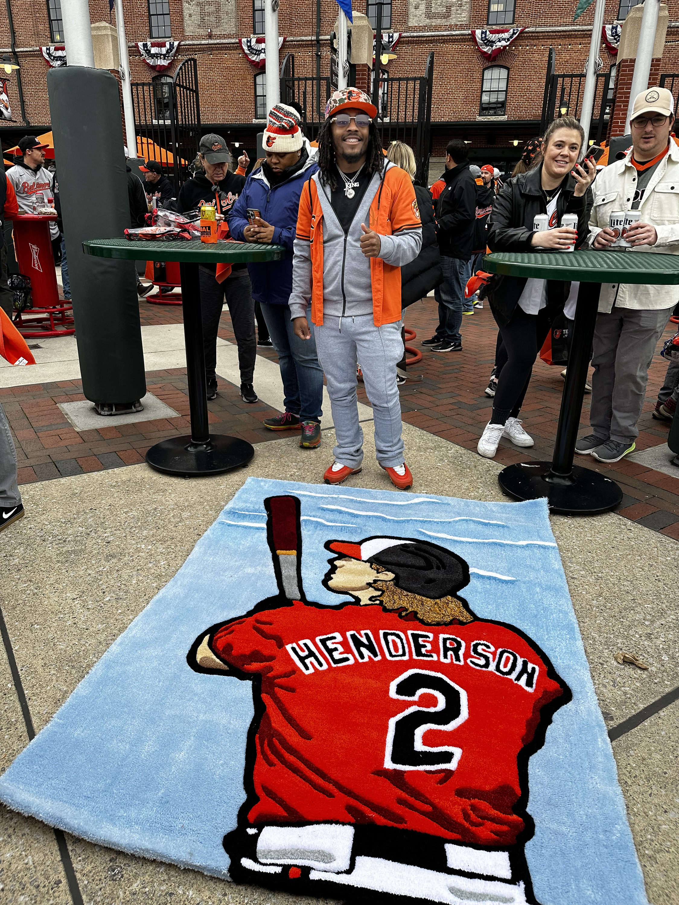 March 28, 2024: Gordan Lander, who went viral for the custom rug he gifted for Lamar Jackson back in November, was at Camden Yards opening day with a custom carpet that he hopes to gift Gunnar Henderson. Lander is excited about new ownership and the hope of hearing Adley Rutschman will sign a lucrative contract. (Sam Cohn/Staff)