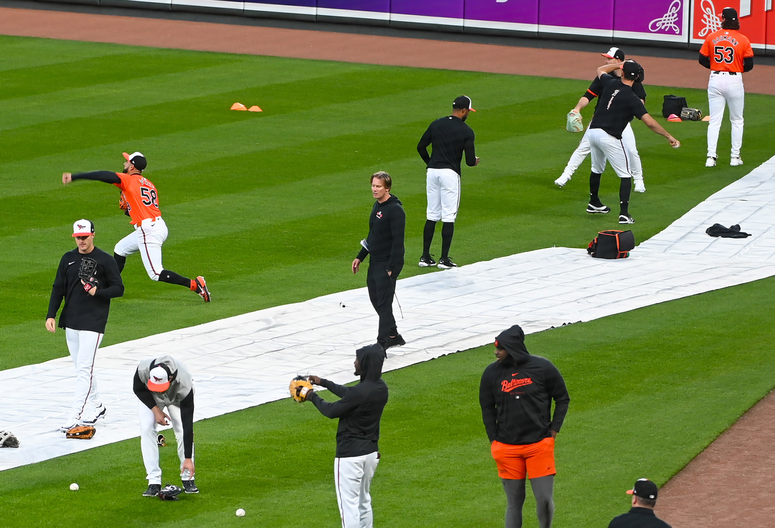 Mar. 26, 2024: Orioles held a workout at Camden Yards before their 2024 Opening Day game on Thursday against the Los Angeles Angels at Orioles Park. Orioles pitchers workout in the outfield during the practice. (Kevin Richardson/Staff)