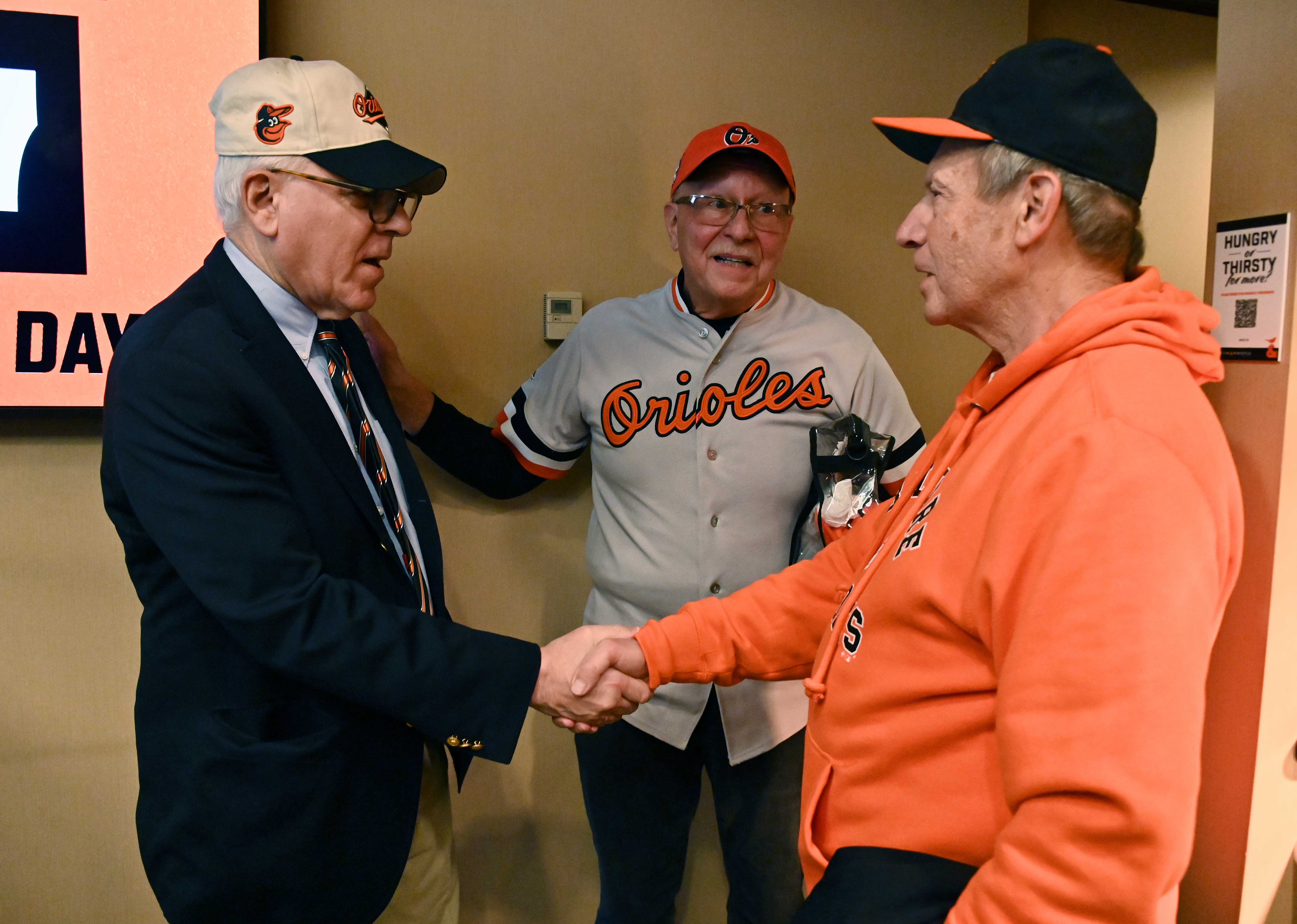 Mar. 28, 2024: From left, new Baltimore Orioles owner David Rubenstein meets Bruce Myers, of Little River, SC, and his friend, right, Jerry Martz, of Leeland, NC, before the Orioles host the Los Angeles Angels at Oriole Park at Camden Yards on opening day. (Kim Hairston/Staff)