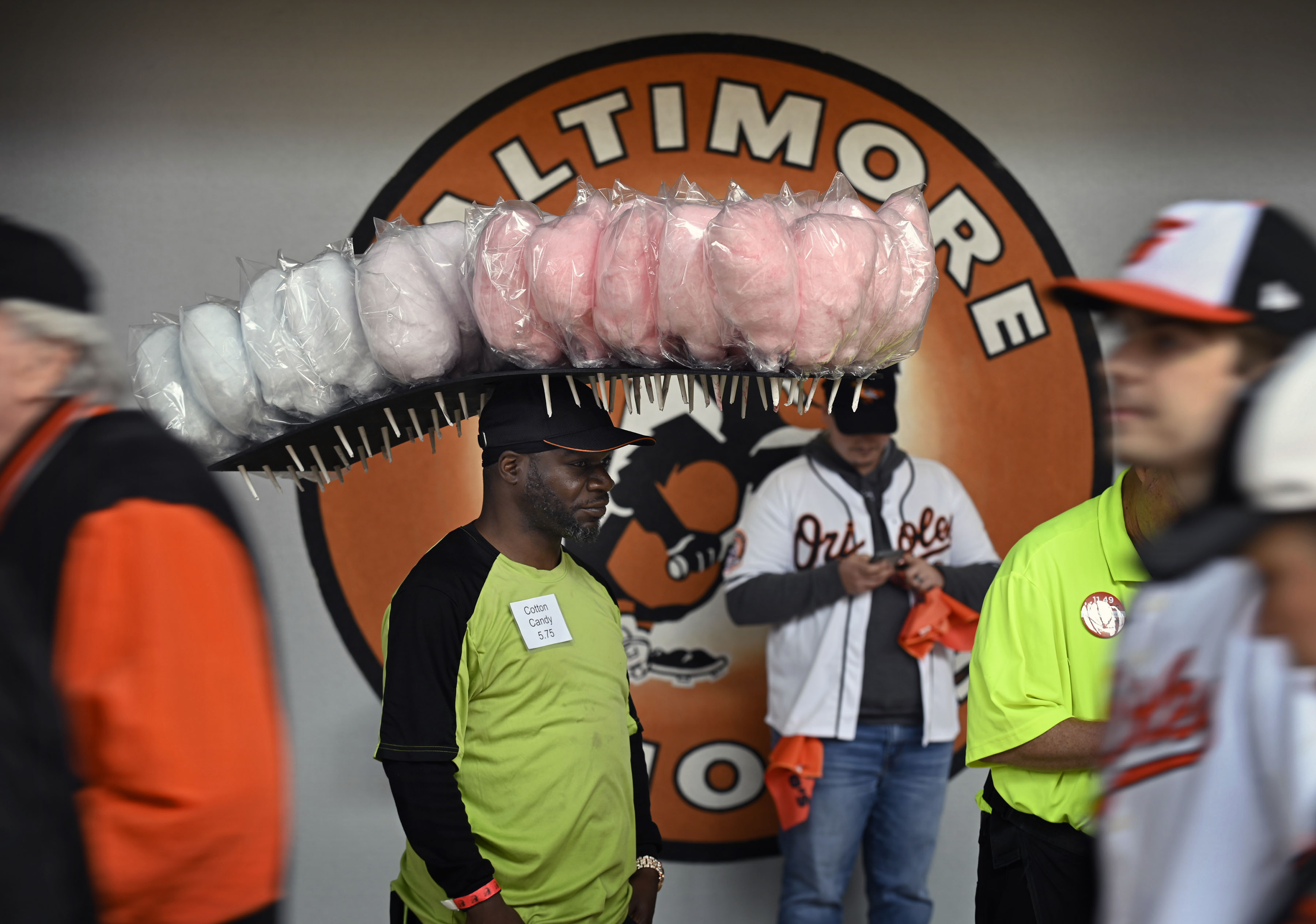 Mar 28, 2024: Kernard Cook, of Baltimore, have his products, cotton candies, on his head for sale during Orioles 2024 season opening day at Oriole Park at Camden Yards. (Kenneth K. Lam/Staff)