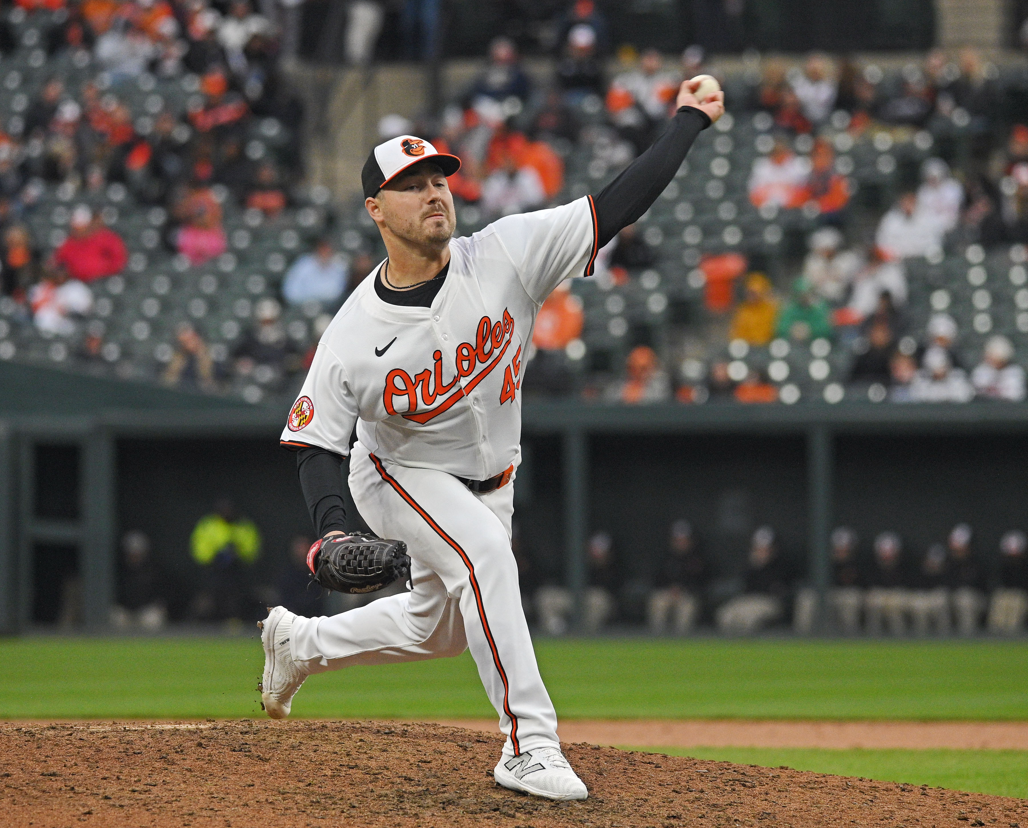 Mar 28, 2024: Orioles pitcher Keegan Akin pitches against the Angels in the ninth inning. The Orioles defeated the Angels 11-3 in their 2024 season opener at Oriole Park at Camden Yards. (Kenneth K. Lam/Staff)