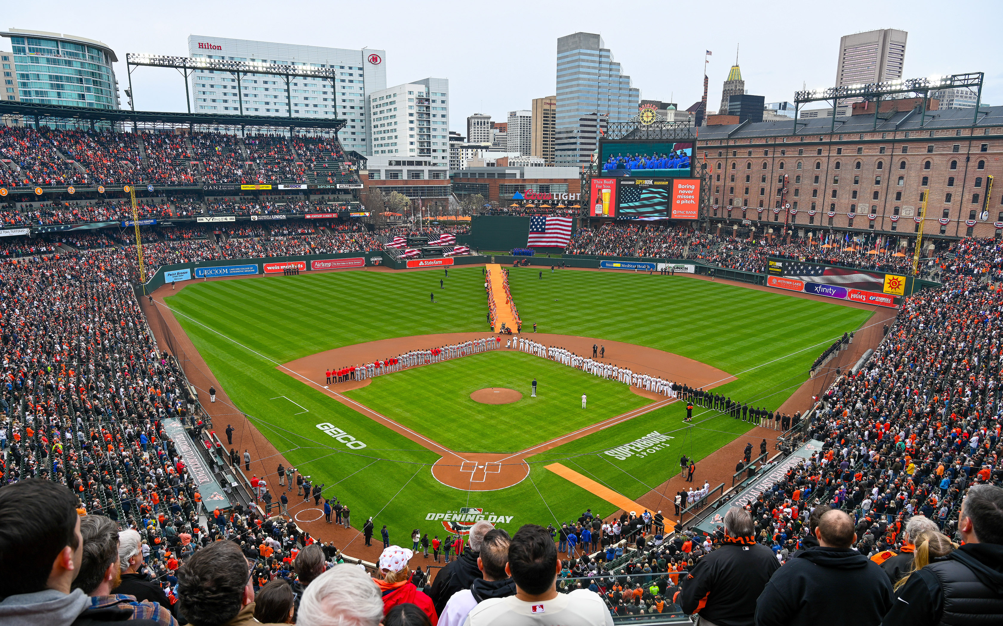 Mar. 28, 2024: : : The Star-Spangled Banner is sung before the start of the opening day baseball game between the Orioles and Los Angelos Angels at Camden Yards. (Kevin Richardson/Staff)